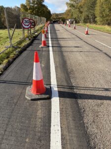Image showing white line tapering away (to the left) from existing carriagewayalignment.